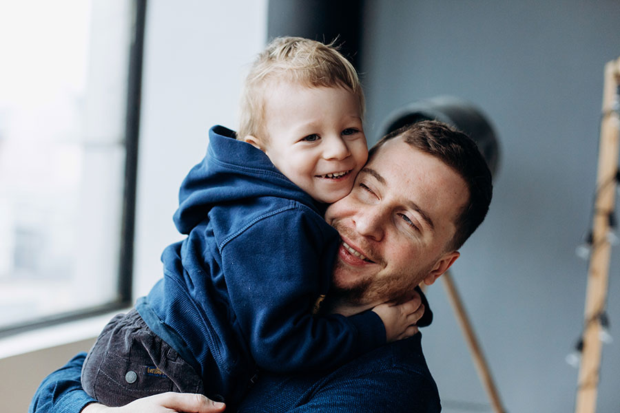 Personal Insurance - Father and Son Hugging and Smiling